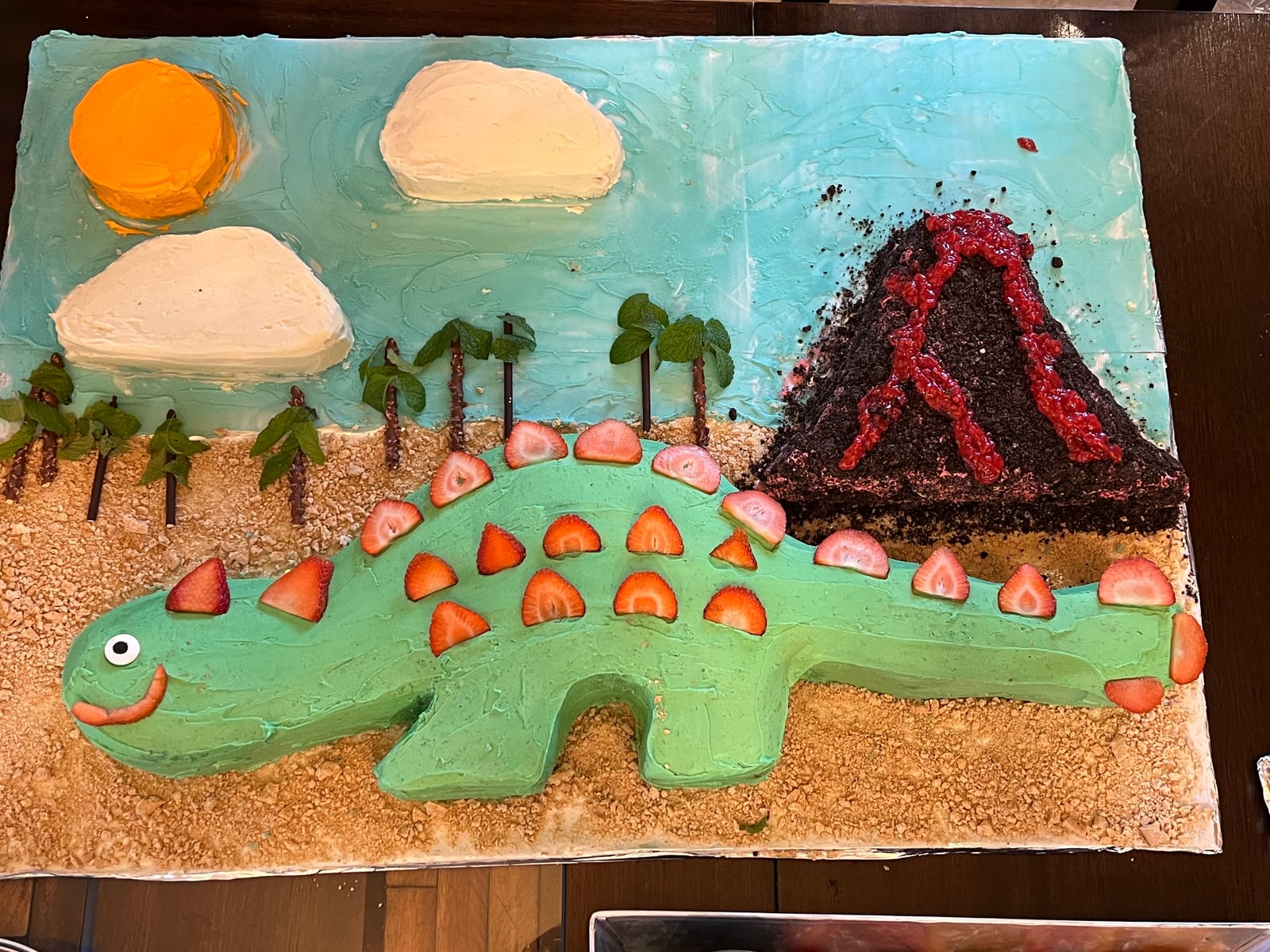 Dinosaur and volcano cake