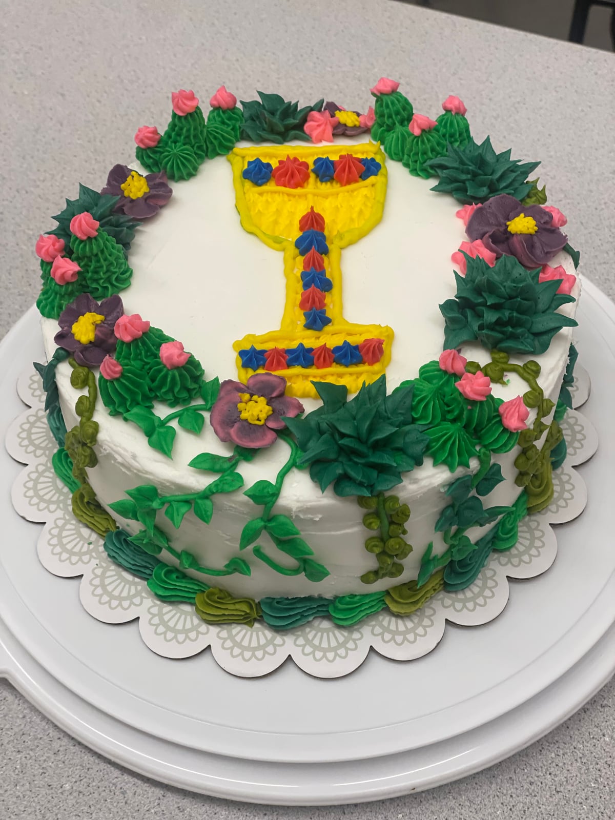 Chalice cake with piped flowers