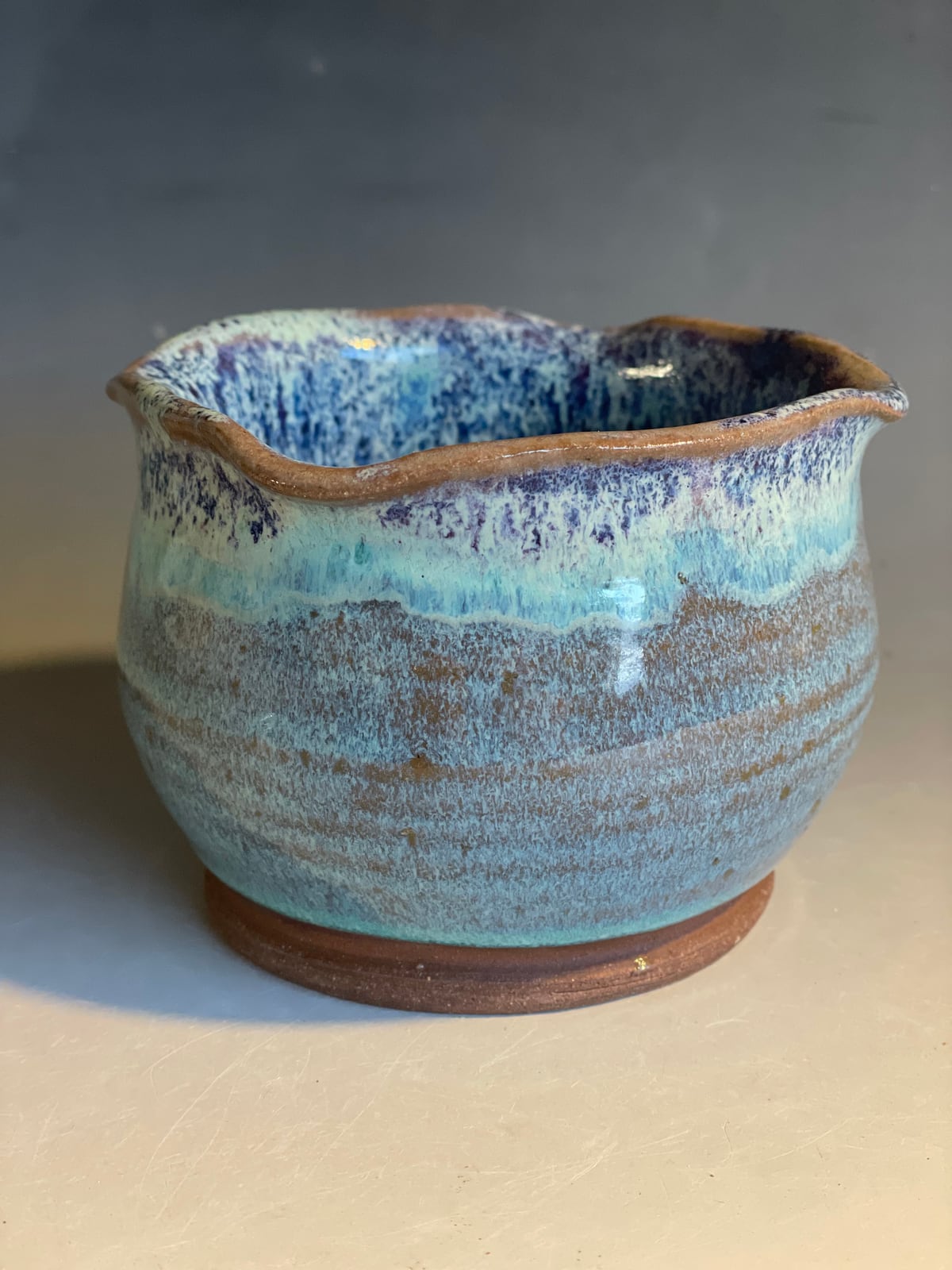 Blue drip pot with a wavy rim