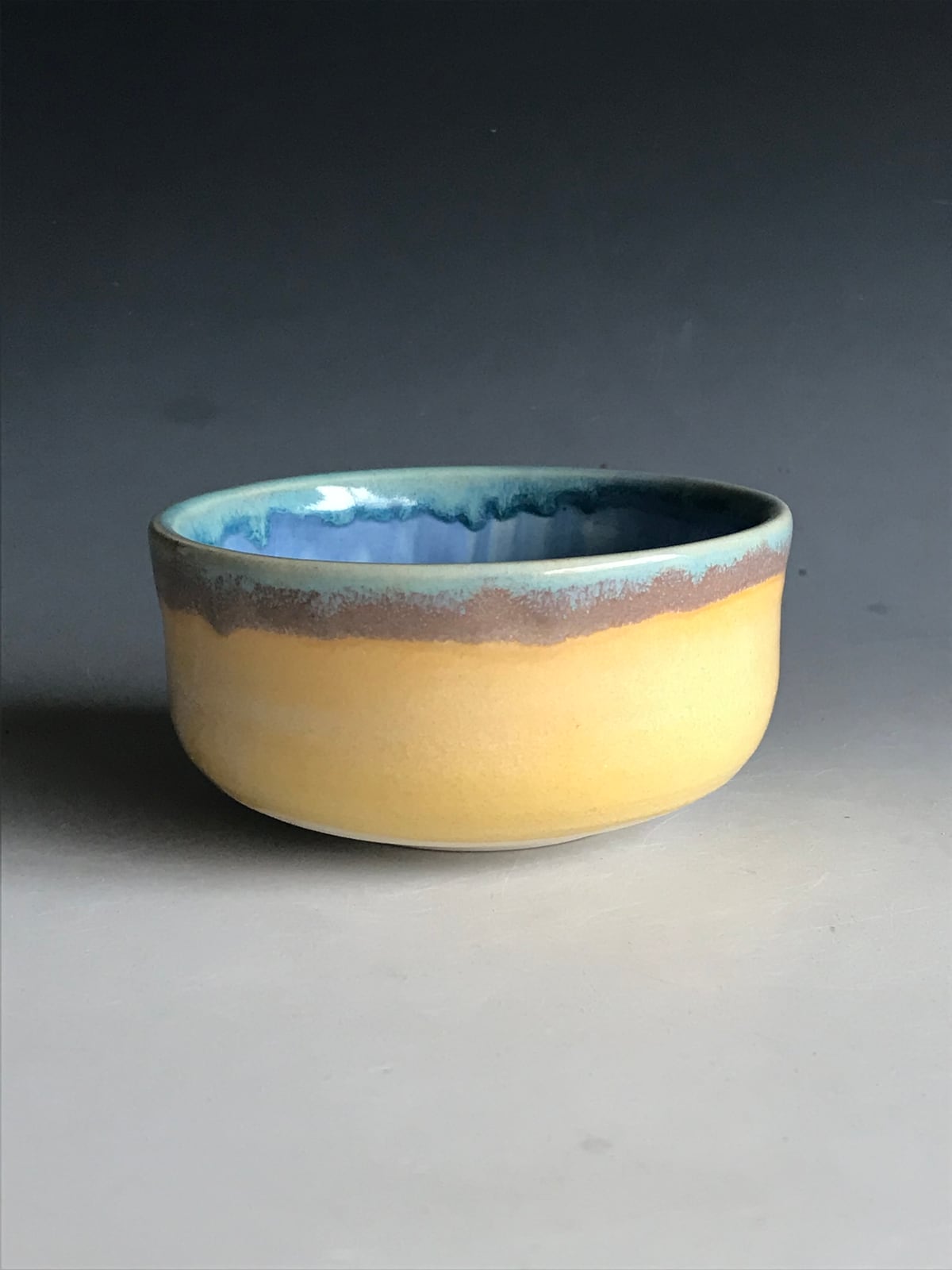 Yellow bowl with a blue rim